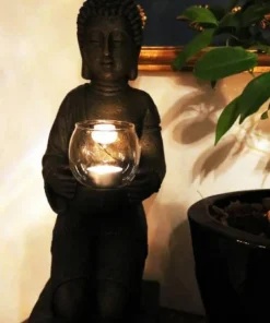 Knælende Buddha med lysglas